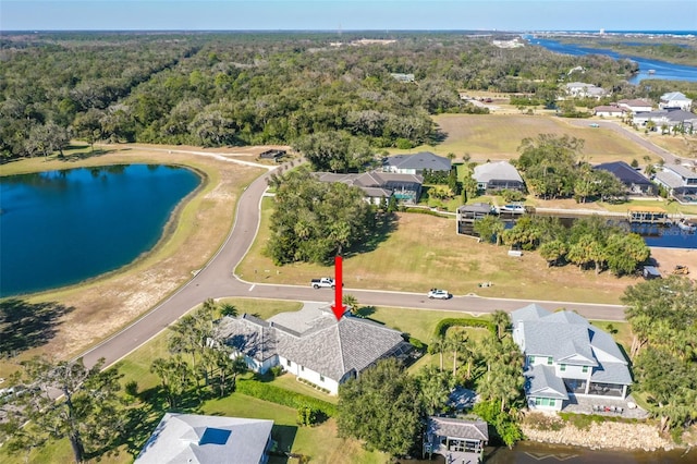 birds eye view of property featuring a water view