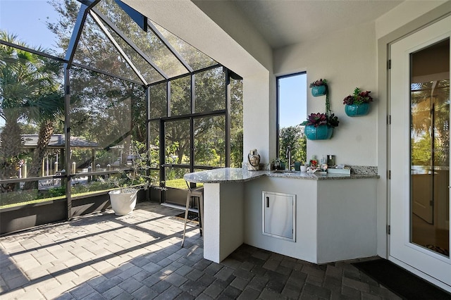 unfurnished sunroom with sink