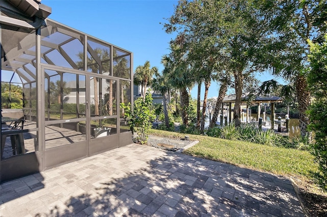 view of patio / terrace featuring a lanai