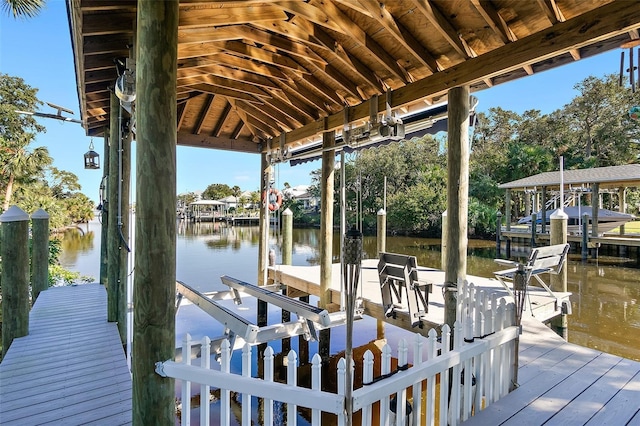 dock area featuring a water view