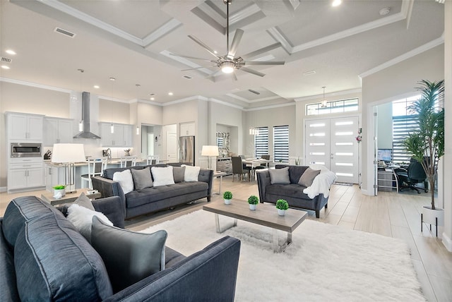 tiled living room featuring beamed ceiling, crown molding, ceiling fan, and coffered ceiling