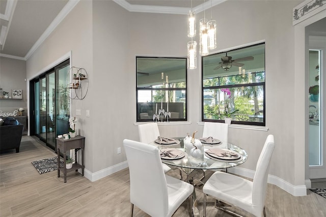 dining space featuring hardwood / wood-style flooring, ceiling fan, a healthy amount of sunlight, and ornamental molding