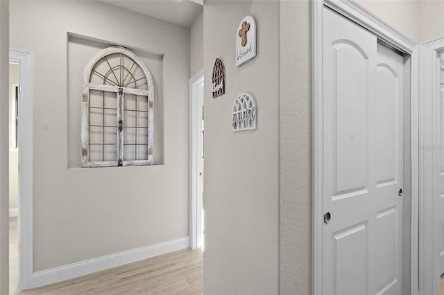 hallway with light wood-type flooring