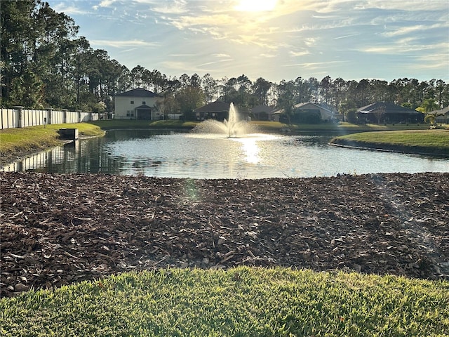 water view featuring fence