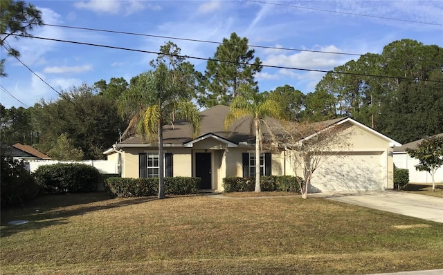 view of front facade with a front lawn and a garage