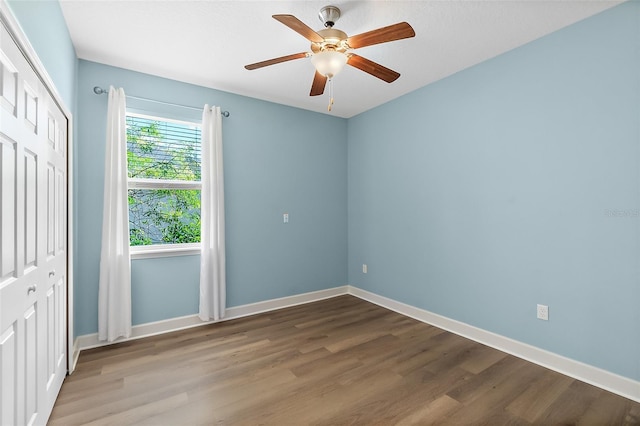 spare room featuring ceiling fan and hardwood / wood-style flooring