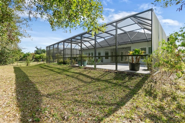 view of yard featuring glass enclosure