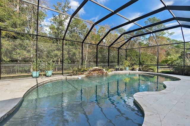 view of pool featuring a lanai and a patio