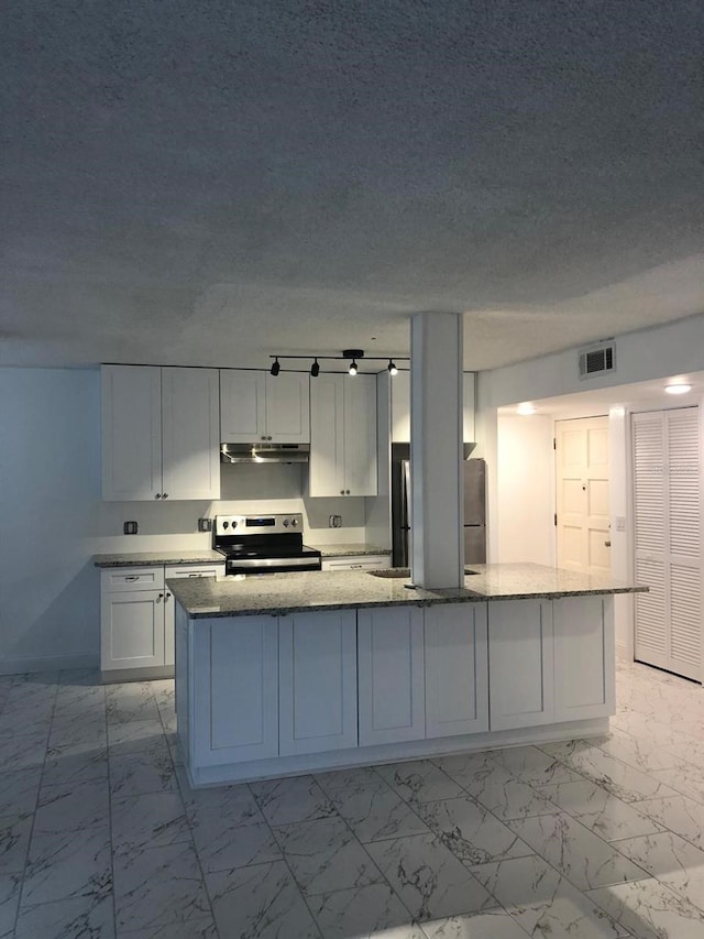 kitchen featuring a center island, light stone countertops, white cabinetry, and appliances with stainless steel finishes