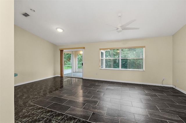 spare room with ceiling fan and vaulted ceiling