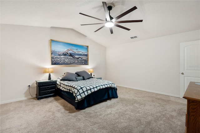 carpeted bedroom featuring ceiling fan and vaulted ceiling