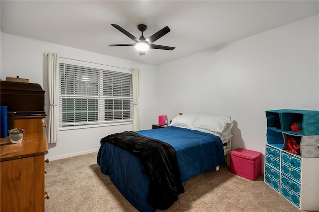 bedroom featuring light carpet and ceiling fan