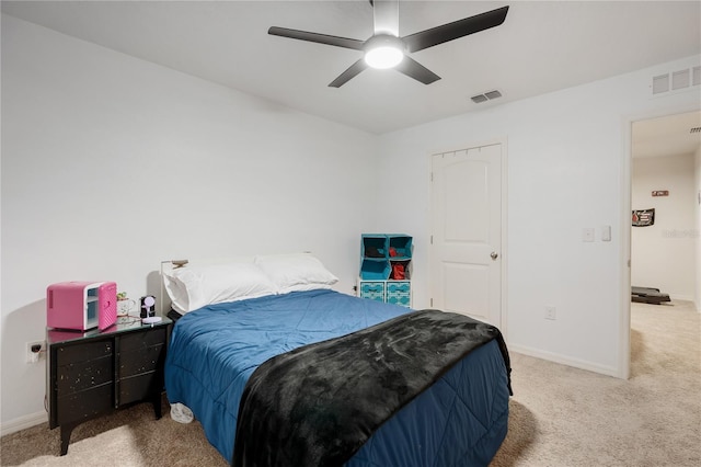 bedroom with ceiling fan and carpet floors