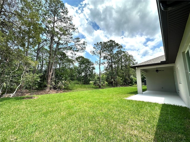 6 Lake Pl, Palm Coast, FL 32137 - view of grassy yard with a patio and ceiling fan
