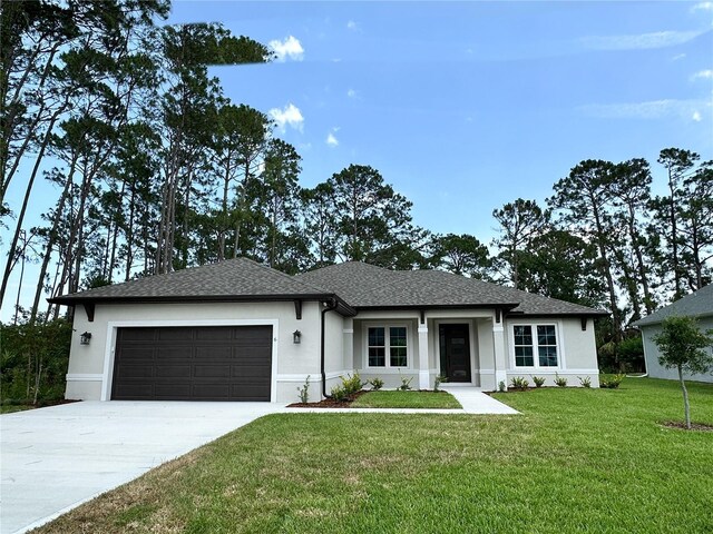 6 Lake Pl, Palm Coast, FL 32137 - view of front of property with an attached garage, concrete driveway, a front yard, stucco siding, and a shingled roof