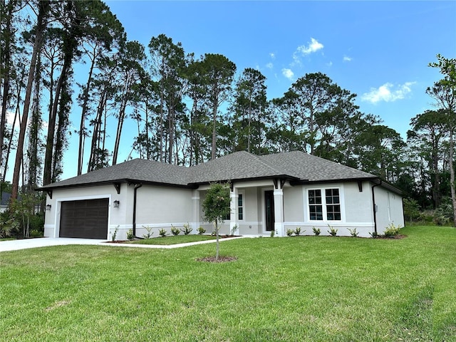 6 Lake Pl, Palm Coast, FL 32137 - prairie-style home with an attached garage, a front yard, stucco siding, and driveway