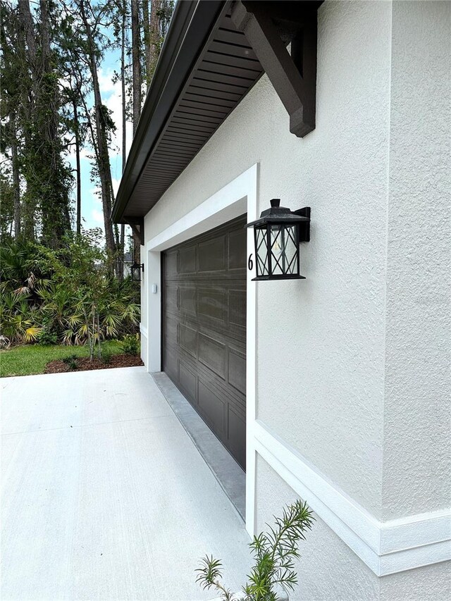 6 Lake Pl, Palm Coast, FL 32137 - garage featuring driveway