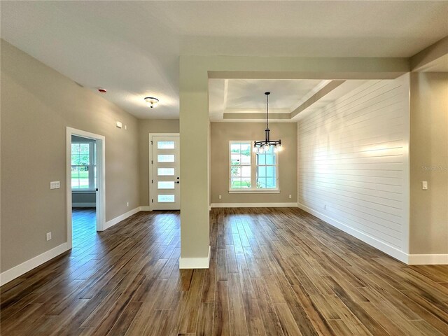 6 Lake Pl, Palm Coast, FL 32137 - empty room with healthy amount of natural light, dark wood finished floors, and baseboards
