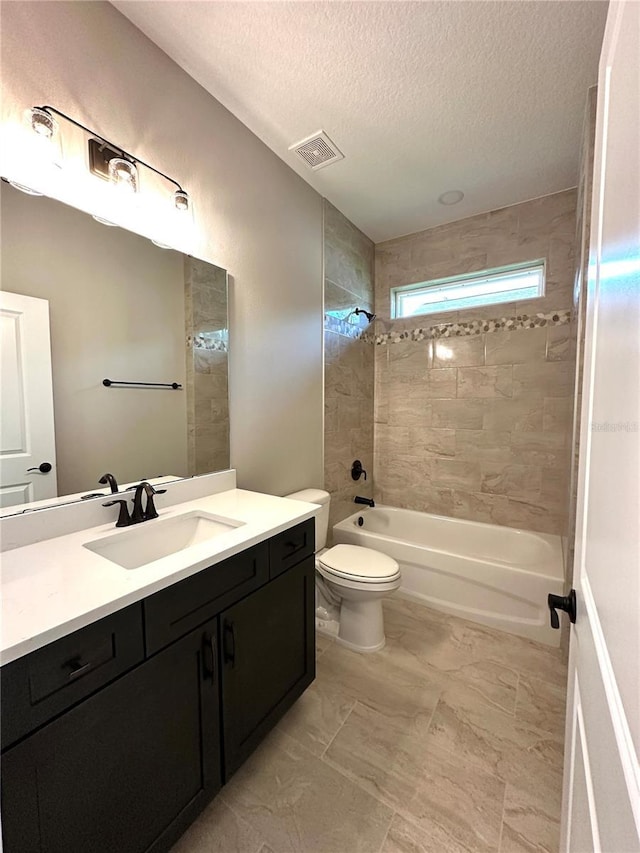 6 Lake Pl, Palm Coast, FL 32137 - bathroom with vanity, a textured ceiling, washtub / shower combination, and toilet