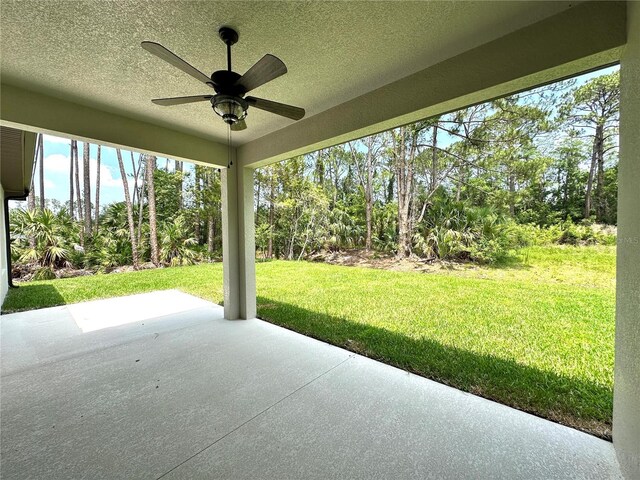 6 Lake Pl, Palm Coast, FL 32137 - view of patio featuring a ceiling fan and view of scattered trees