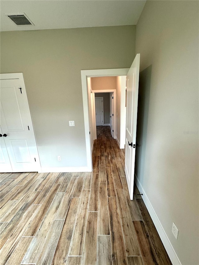 6 Lake Pl, Palm Coast, FL 32137 - empty room featuring wood finished floors and baseboards