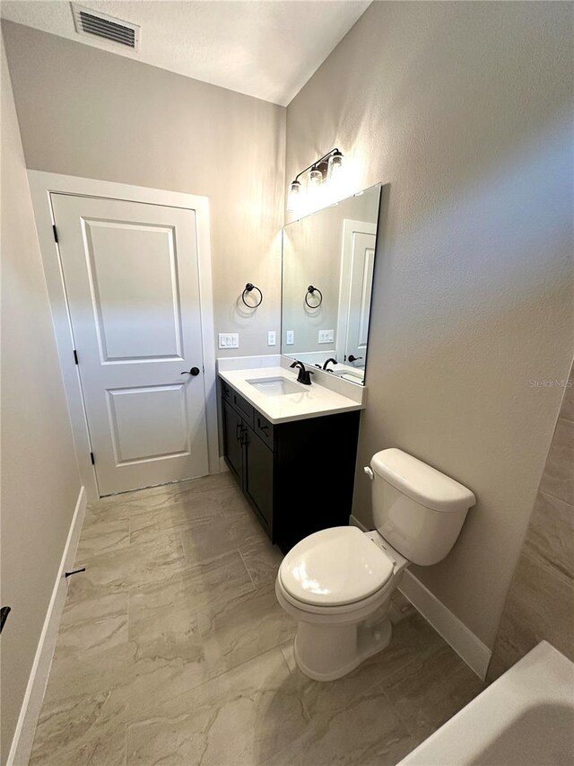 6 Lake Pl, Palm Coast, FL 32137 - bathroom with marble finish flooring, toilet, and baseboards
