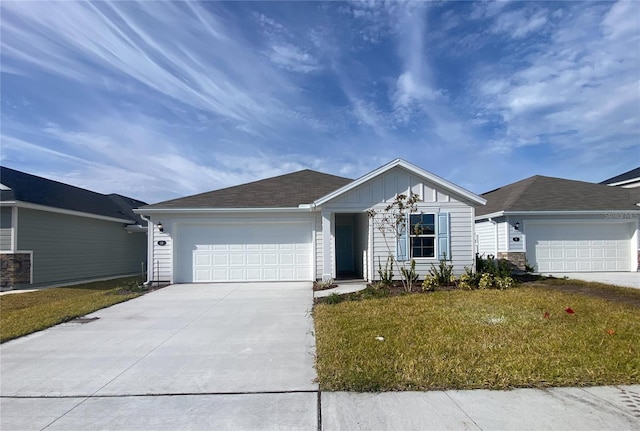 10 Windor Ter, Palm Coast, FL 32164 - ranch-style home featuring a garage, driveway, a front lawn, and board and batten siding