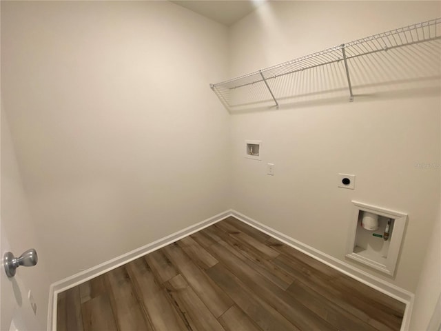 washroom featuring hardwood / wood-style floors, hookup for an electric dryer, and hookup for a washing machine