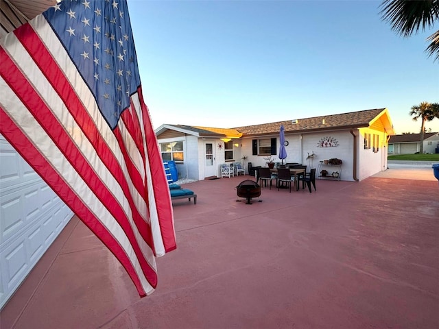 view of patio / terrace with an outdoor fire pit