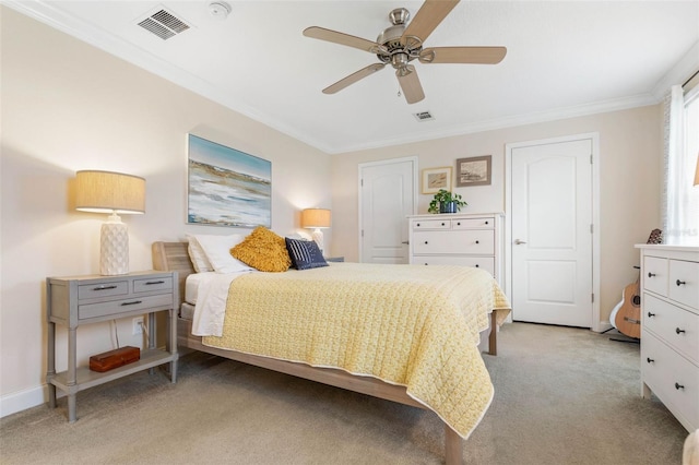 bedroom with ceiling fan, crown molding, and light carpet