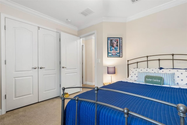 bedroom with a closet, light colored carpet, and ornamental molding