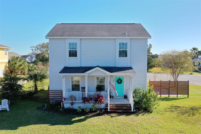 view of front of house with a front lawn and covered porch