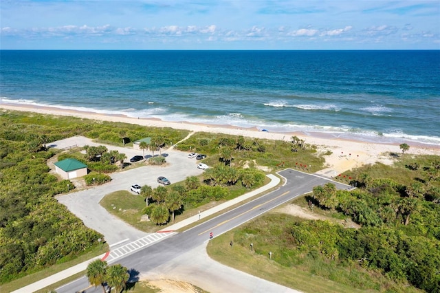 aerial view featuring a water view and a beach view