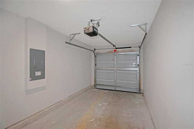 garage with a garage door opener and electric panel