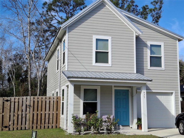 view of front of property featuring a garage and a porch