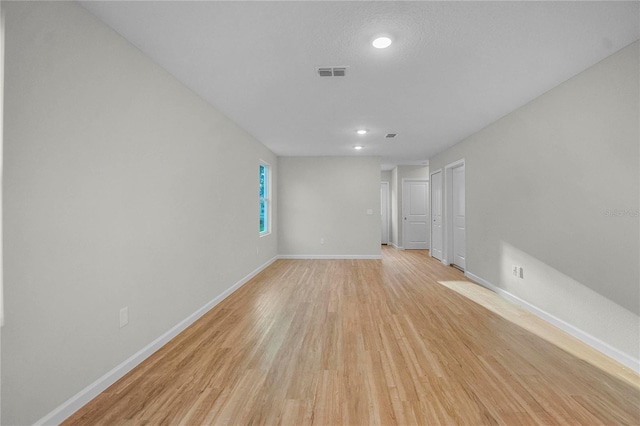 unfurnished room featuring light wood-type flooring