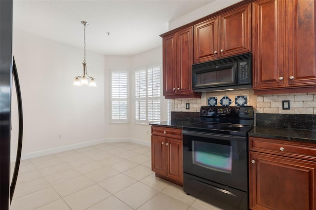 kitchen with black appliances, decorative light fixtures, dark stone countertops, and light tile patterned floors