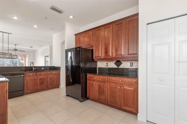 kitchen with ceiling fan, sink, backsplash, dark stone countertops, and black appliances