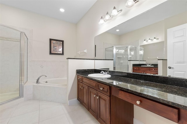 bathroom with tile patterned floors, vanity, and plus walk in shower