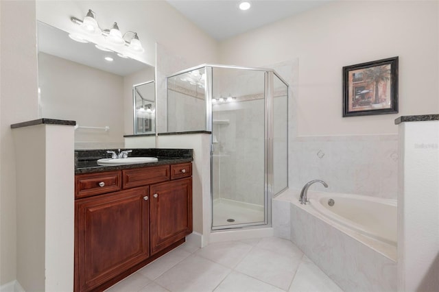 bathroom with tile patterned flooring, vanity, and plus walk in shower