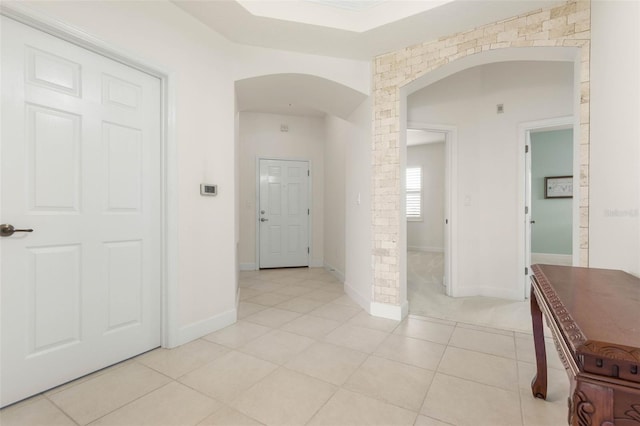 hallway featuring light tile patterned floors