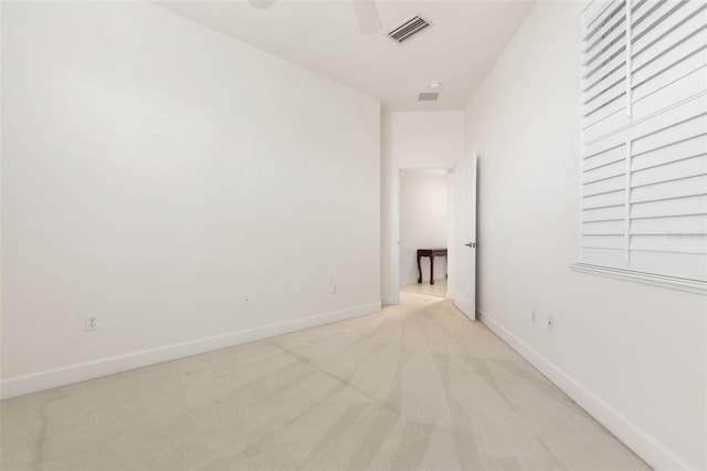 unfurnished room with light colored carpet