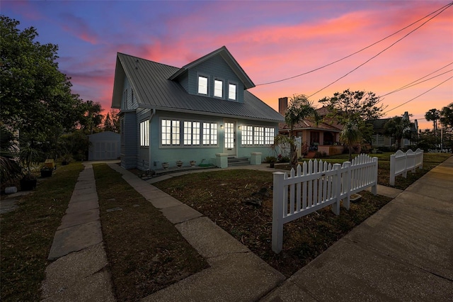 view of front of house with an outdoor structure