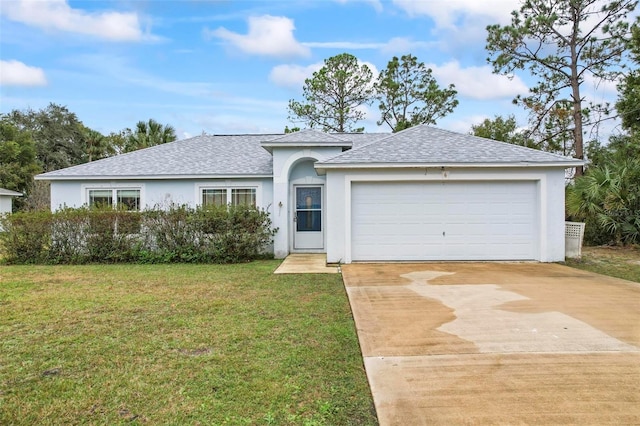 ranch-style house with a garage and a front lawn