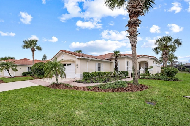 mediterranean / spanish-style home with a front yard and a garage