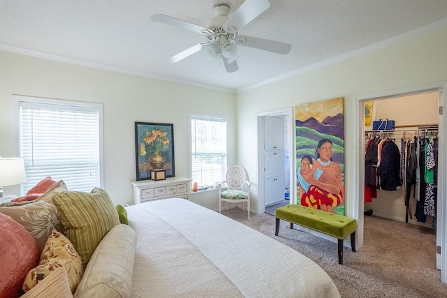 carpeted bedroom featuring ceiling fan and ornamental molding