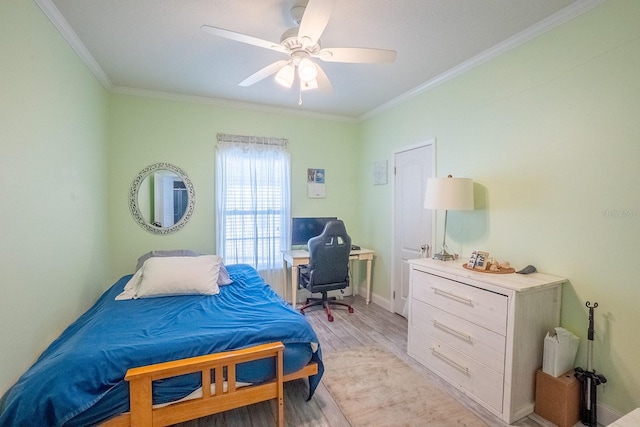 bedroom featuring ceiling fan, light hardwood / wood-style flooring, and crown molding