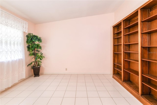 unfurnished room featuring vaulted ceiling