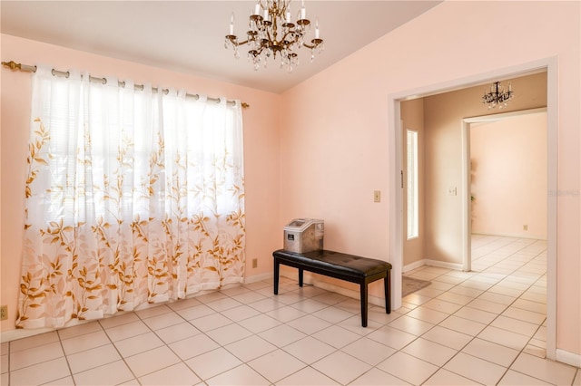 unfurnished room featuring light tile patterned floors, a chandelier, and vaulted ceiling