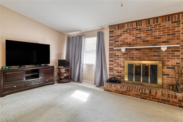 living room featuring light colored carpet and a fireplace